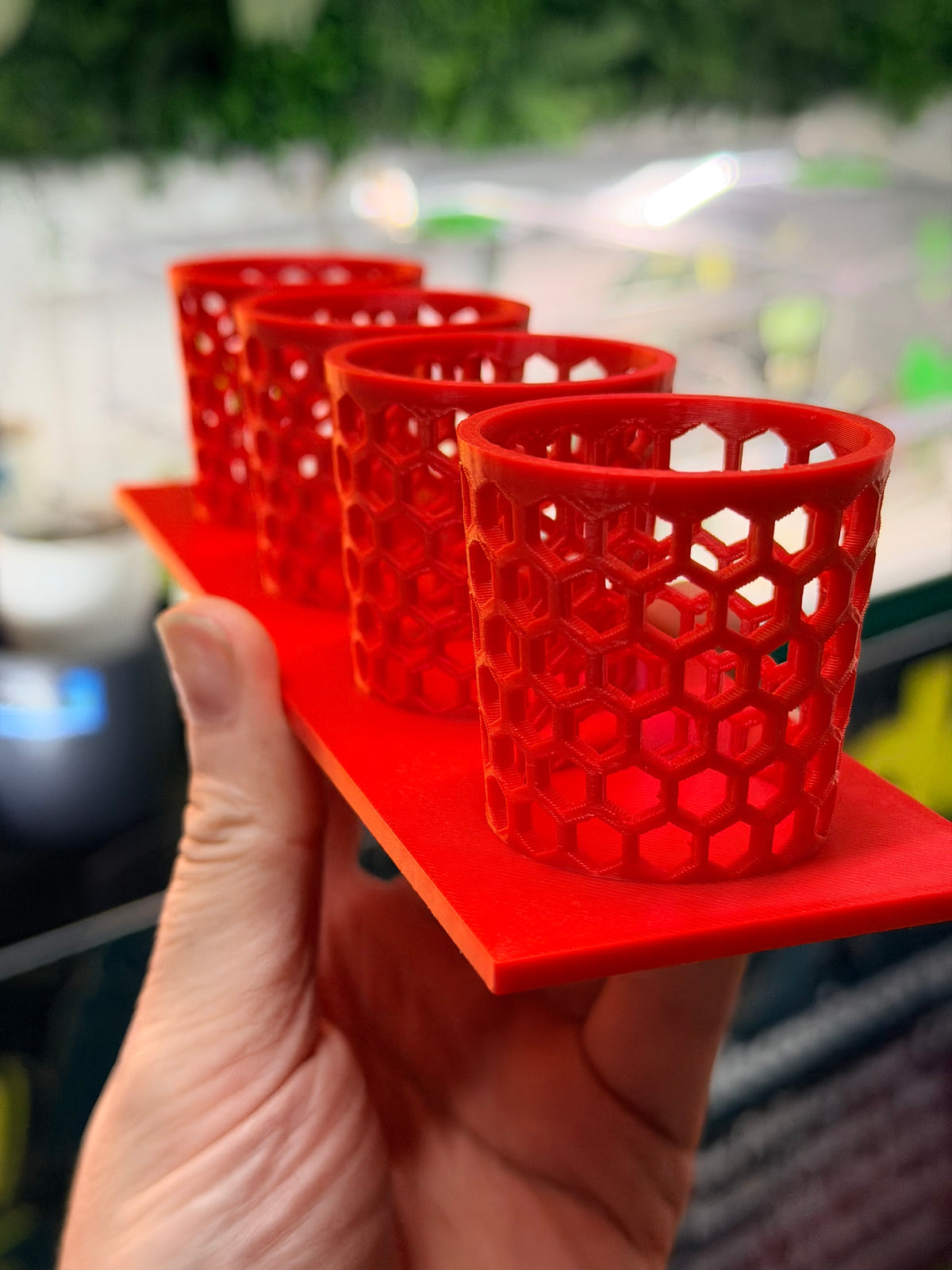 Corm Keeper, a 3D-printed rack holding four corm propagation pots stable and upright