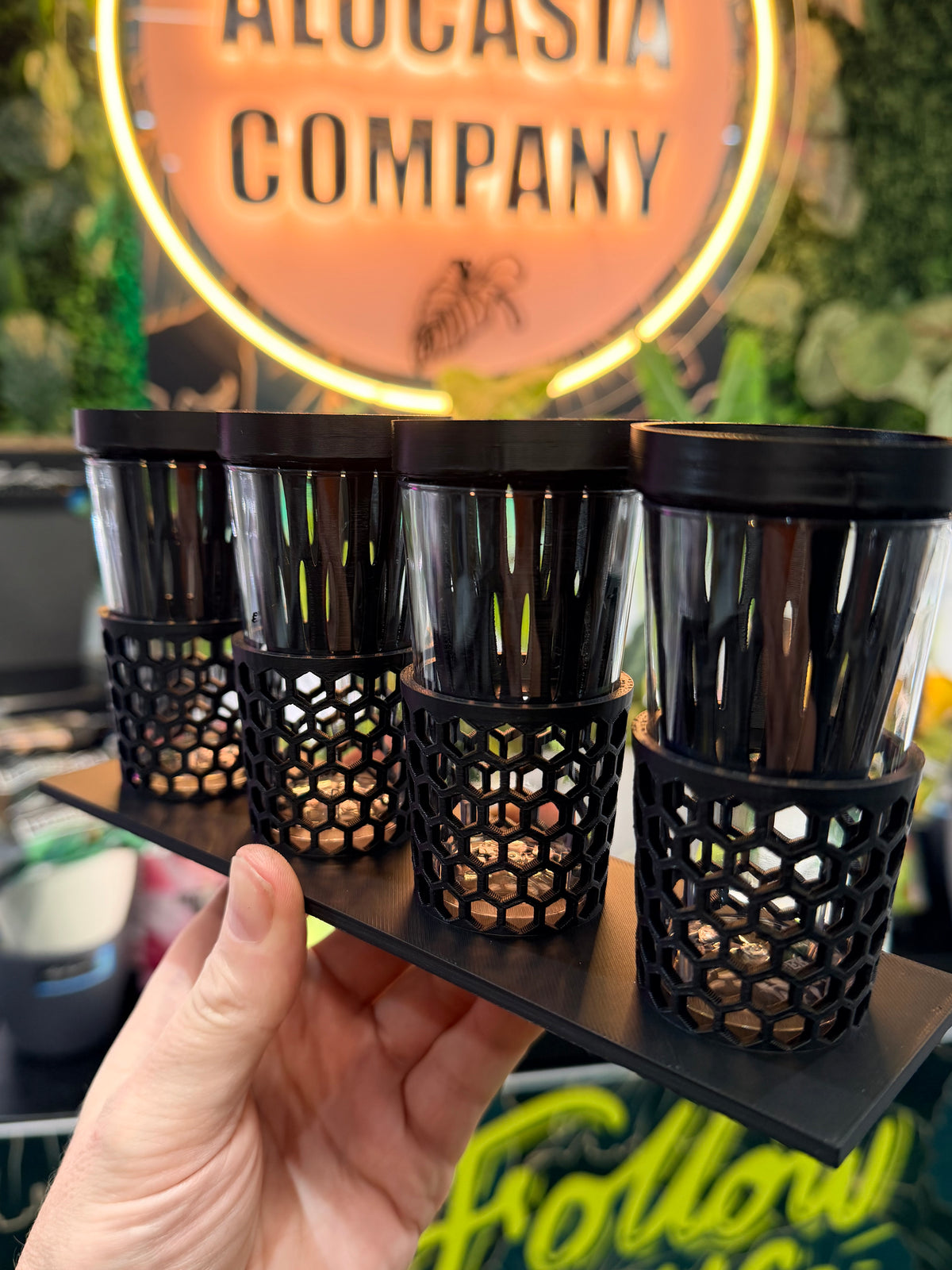 Corm Keeper, a 3D-printed rack holding four corm propagation pots stable and upright